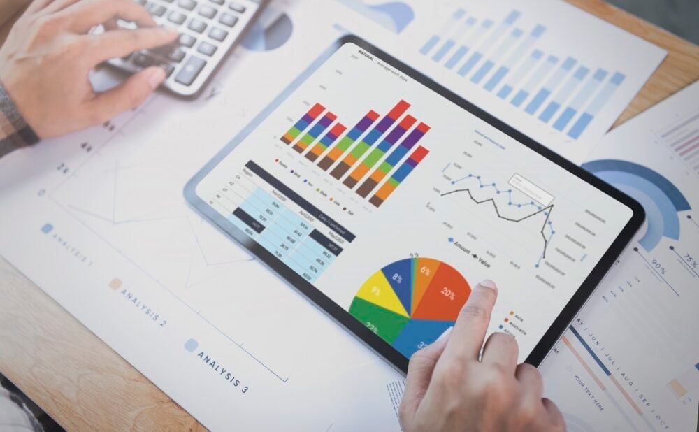 businesswoman using tablet analysis graph company finance strategy statistics success concept planning future office room e1668151641324